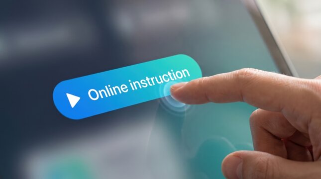 Finger of a person presses the blue online instruction button on a digital touchscreen tablet.