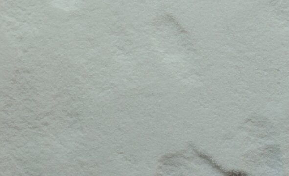 Close Up Texture Of Fine White Powder Sugar Or Salt Background