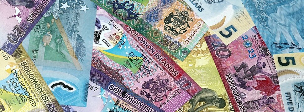 Big amount of Solomon Islands dollar money banknotes. Solomon Islands cash bills of SBD currency