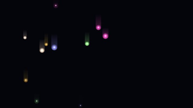 Colorful glowing falling light trails drift against a solid black dark background