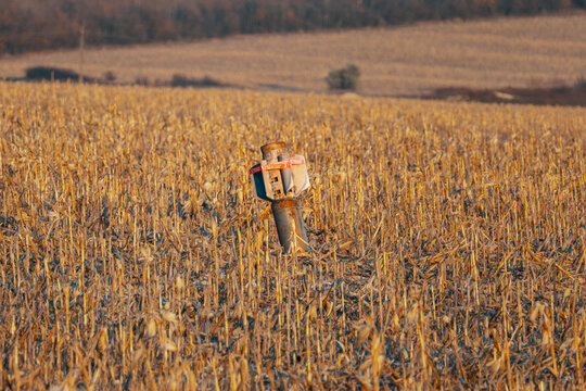 Unexploded rocket in a Ukrainian field after a Russian strike, reflecting the wider campaign of missiles and jet-powered Shahed drones targeting Kyiv and essential infrastructure.