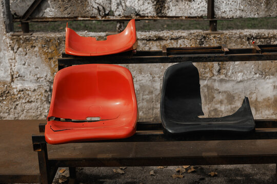 Broken Plastic Stadium Seats on Empty Stands &ndash; Vandalism, Neglect and Damaged Sports Arena Concept