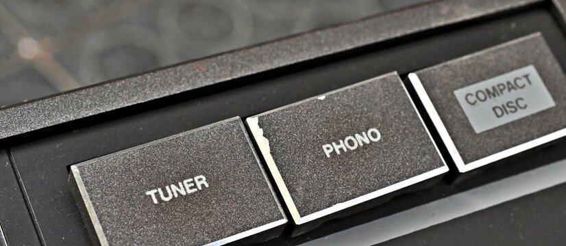 Close up of vintage audio selector buttons tuner phono compact disc