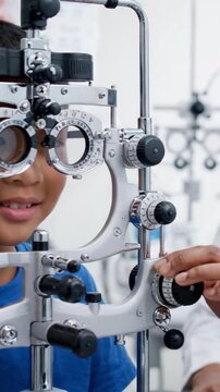Child Receiving an Eye Examination with Advanced Optical Equipment in a Professional Setting, Emphasizing the Importance of Vision Health and Regular Check-Ups.