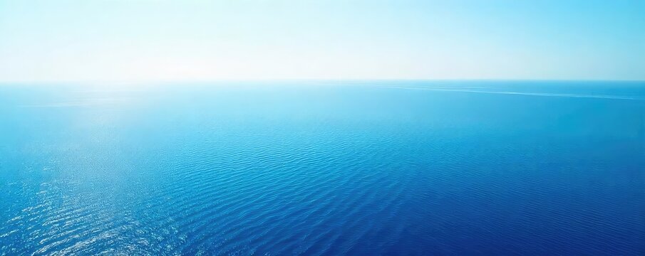 Vast, serene ocean stretching to the hazy horizon, a breathtaking view of endless blue water under a clear sky Perfect for travel, nature, and serenity themes , seascape, panorama