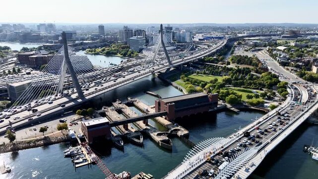 Drone flight above the bridges and roads with cars over Charles river. Boston. Massachusetts, USA