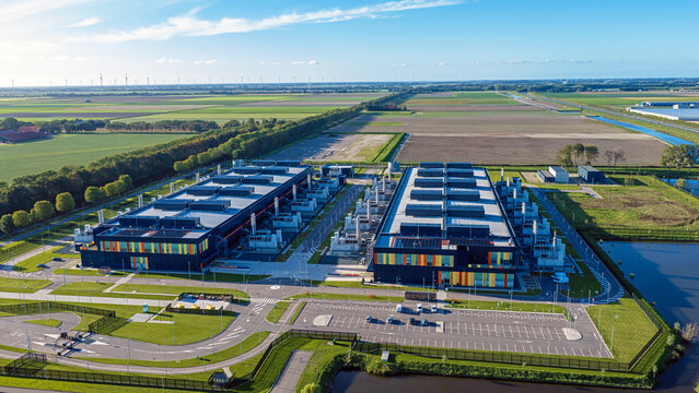 Aerial view of the Microsoft datacenter complex surrounded by green agricultural fields and rural roads in Middenmeer, Noord-Holland, Netherlands.
