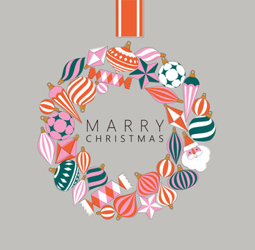 Christmas wreath composed of large shiny glass ornaments toys and decorative baubles drawing on grey background