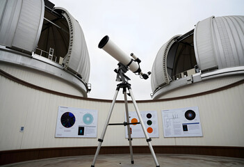 Fototapeta premium Astronomy and space exploration, telescope at an observatory with scientific research posters and open domes for stargazing and celestial observation