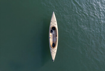 Fototapeta premium Adventure travel and outdoor recreation, empty kayak floating on calm water surface viewed from above for summer vacation and active lifestyle