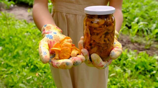 Preservation of chanterelle mushrooms in a jar. Selective focus.