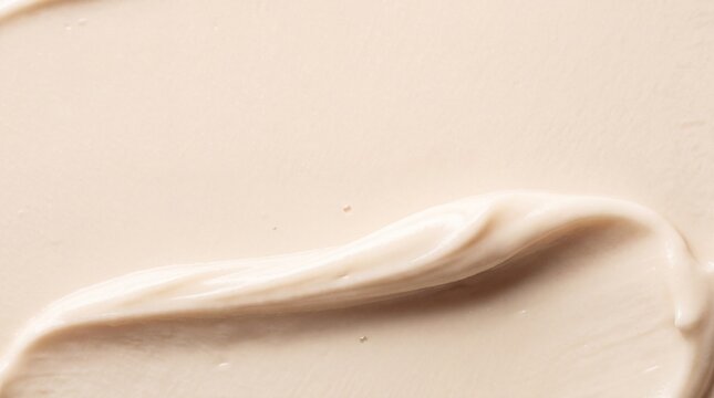 Cream Texture Swatch. Smooth beige skincare smear background