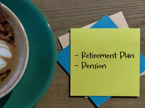 Retirement planning concept with handwritten retirement plan and pension notes beside a cup of coffee, representing financial preparation, savings and future security.