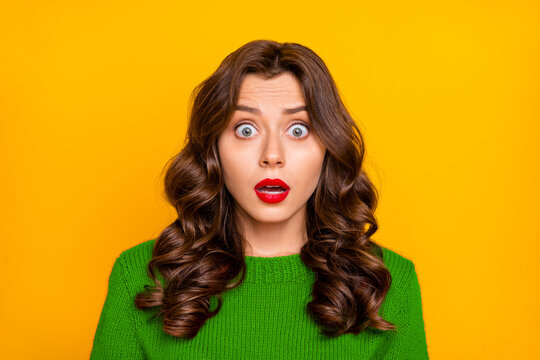 Photo of curly wavy feared terrified horrified astonished girlfriend emotional with frightful face expression seeing something negatively unbelievable isolated over yellow bright color background