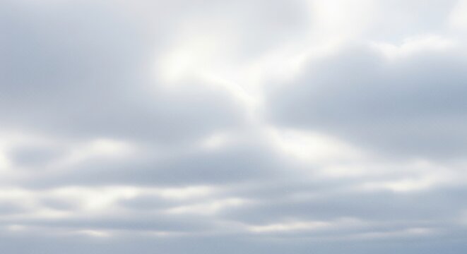 Sun breaking through cloudy sky.
