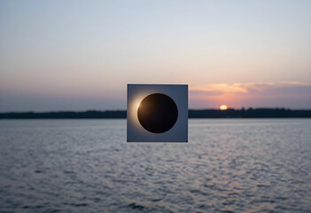 Fototapeta premium Solar eclipse concept artificial moon blocking sun over water at sunset astronomical event and celestial alignment science education and nature