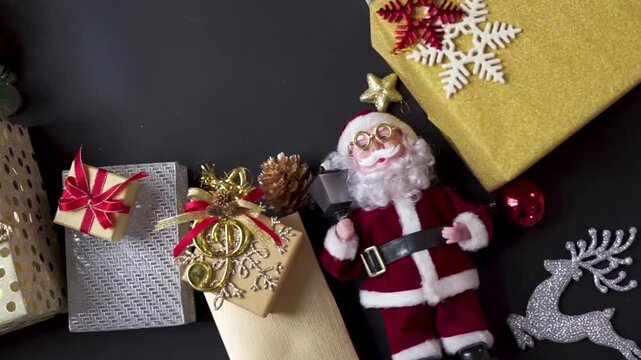 An elegant Christmas decoration layout set against a black background, viewed from directly above (flat lay). 