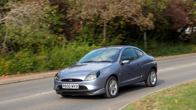 Milton Keynes; UK - Sept. 27th 2026: 1997 Ford Puma classic car driving on a British road