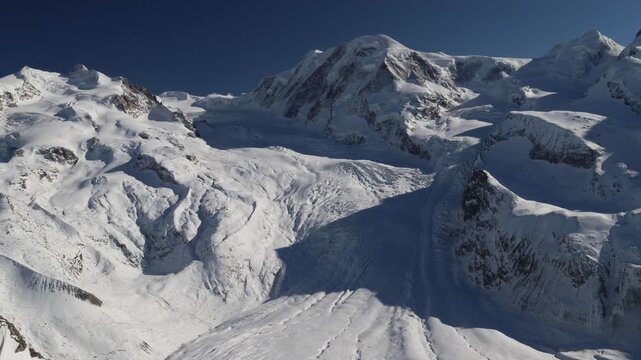 Dufourspitze mountain peak and glacier covered in snow in winter