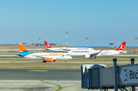 Istanbul, Turkey - September 25, 2026: Azimuth Airlines Sukhoi Superjet 100 and Turkish Airlines Airbus planes taxiing on the airport runway tarmac