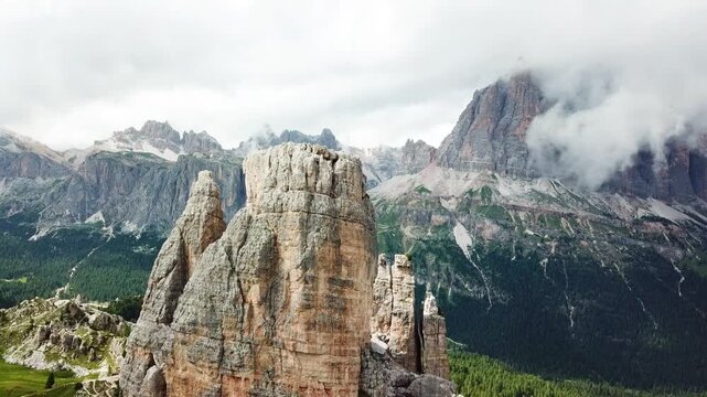 Rock pinnacles beneath drifting mountain clouds in the Dolomites Italy
