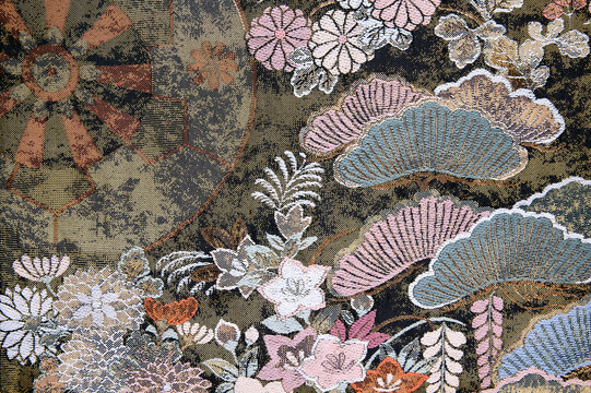 Japanese pine and floral brocade pattern on dark background