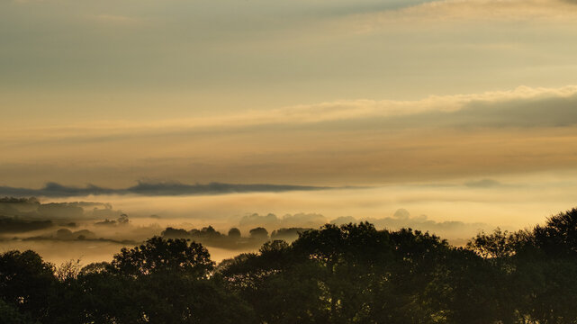 Misty autumn daybreak over Cornish countryside, symbolising a new beginning, a fresh start