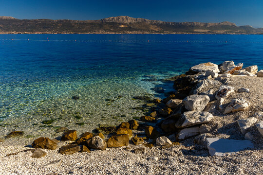 Empty Acida Beach on Ciovo Island with panoramic view of Ka&scaron;tela, Croatia