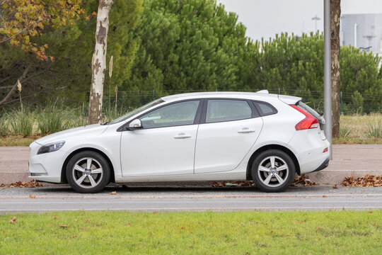 White volvo v40 hatchback parked on urban street