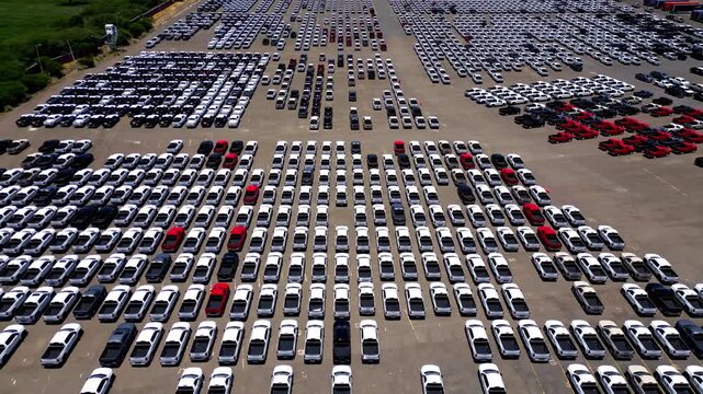 New cars parking at automotive factory lot for export