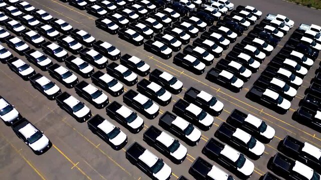 Brand new cars at a car factory parking lot