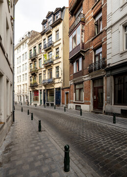 Quaint narrow street full of beautiful historic buildings in Brussels, Belgium, Europe
