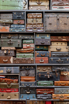 Stack of colorful vintage suitcases of all shapes and sizes, great as a travel background
