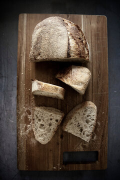 Rustic Yeast bread sliced on wooden cutting board
