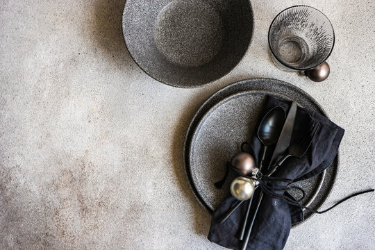 Minimalist Christmas table setting with black stoneware