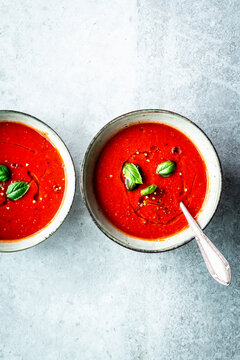 Quick tomato soup garnished with basil and olive oil
