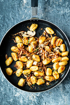 Gnocchi with Pulled mushroom and Thyme in frying pan
