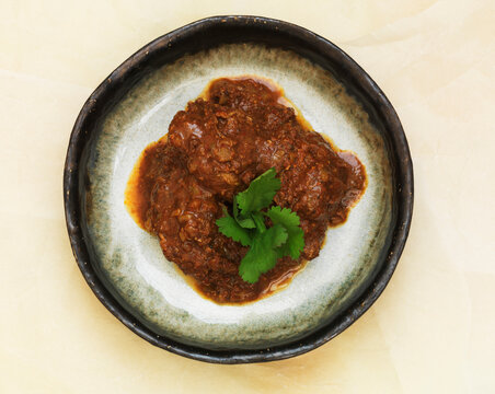 Pork Vindaloo curry with coriander