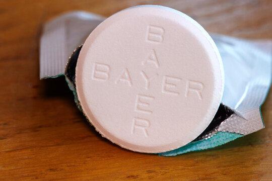Macro close-up of Bayer Aspirin tablets. Aspirin contains acetylsalicylic acid, which was first synthesized in a chemically pure and stable form in 1897 by Bayer chemist Felix Hoffmann.