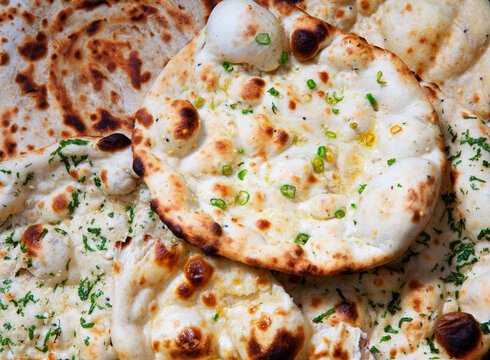 Indian naan breads with herbs and chili peppers