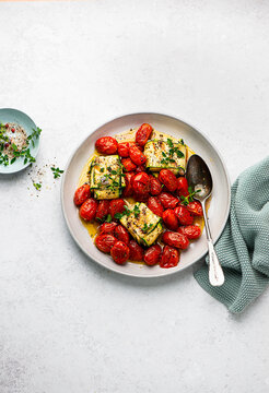 Courgette fish parcels with tomatoes