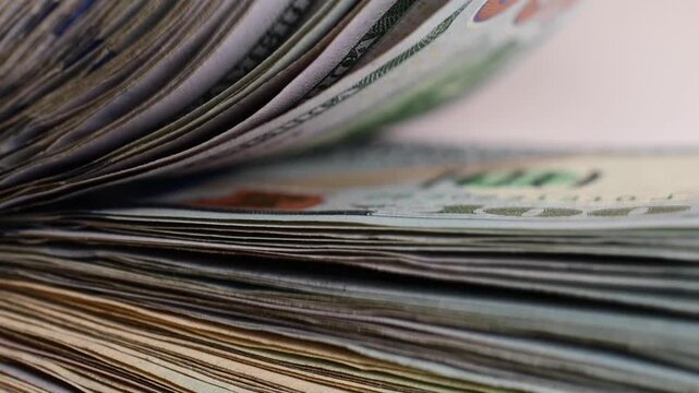 Stock of hundred dollars bills bokeh macro close up, texture, in and out of focus, abstract money finances, studio selective focus real time video	