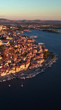 Sibenik, Croatia, aerial view of the historic coastal city, old town, marina, and Adriatic sea at sunset