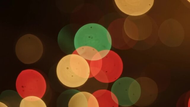 Vibrant blur of warm and cool festive lights creating a beautiful bokeh effect
