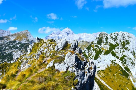 Peak of Triglav mountain from the rock and grass covered Vi&scaron;evnik in Julian alps, Gorenjska, Slovenia