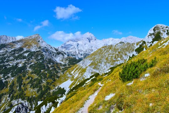 Hiking trail at alpine landscape with Triglav mountain peak and Veliki Dra&scaron;ki Vrh in Julian alps, Gorenjska, Slovenia