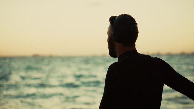 Triathlete Warming Up During Sunset Training Session For Competition