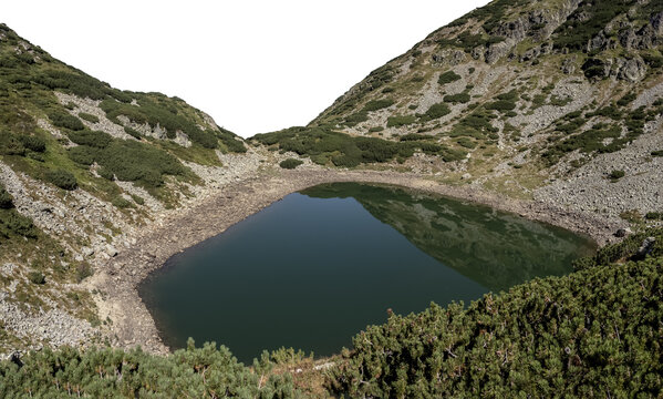 Mija glacial lake isolated on a transparent background, surrounded by rocky peaks and dwarf pines in the Parang Mountains, Romania. Nature and landscape photography concept.