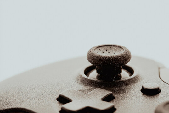 Close-up of a black game controller joystick