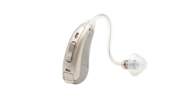 Silver behind ear hearing aid with clear tube and earpiece for auditory assistance and improved hearing.